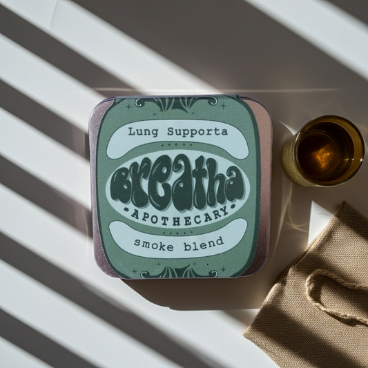 Tin labeled 'Lung Supporta Breatha Apothecary smoke blend' on a striped surface.